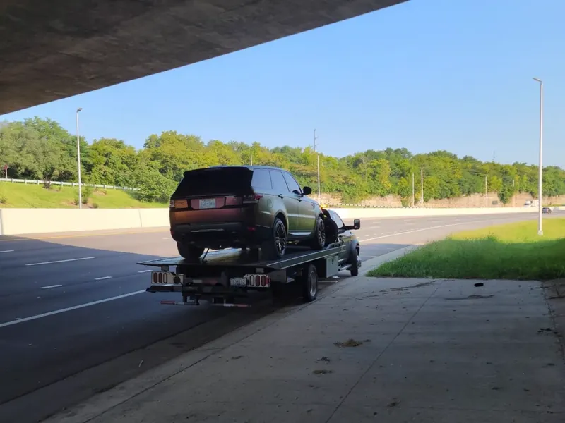 Medium duty towing Nashville - commercial sprinter van secured on a flatbed