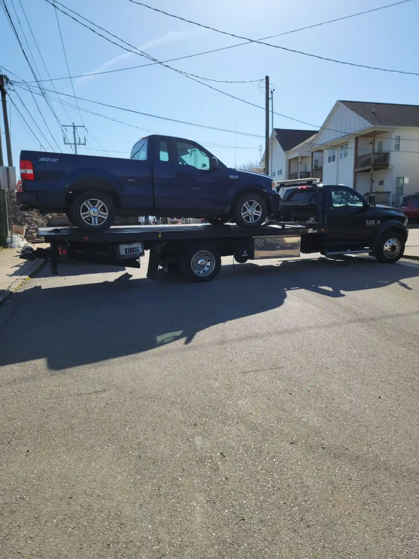 Tow truck providing emergency roadside assistance during winter in Nashville TN
