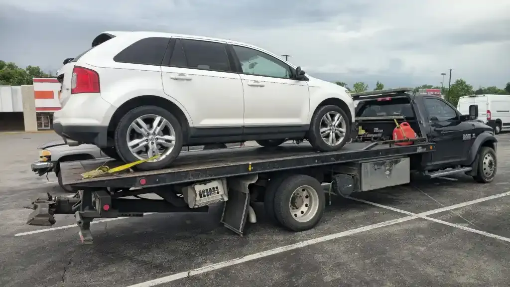 Ford Edge SUV loaded on a flatbed in Nashville