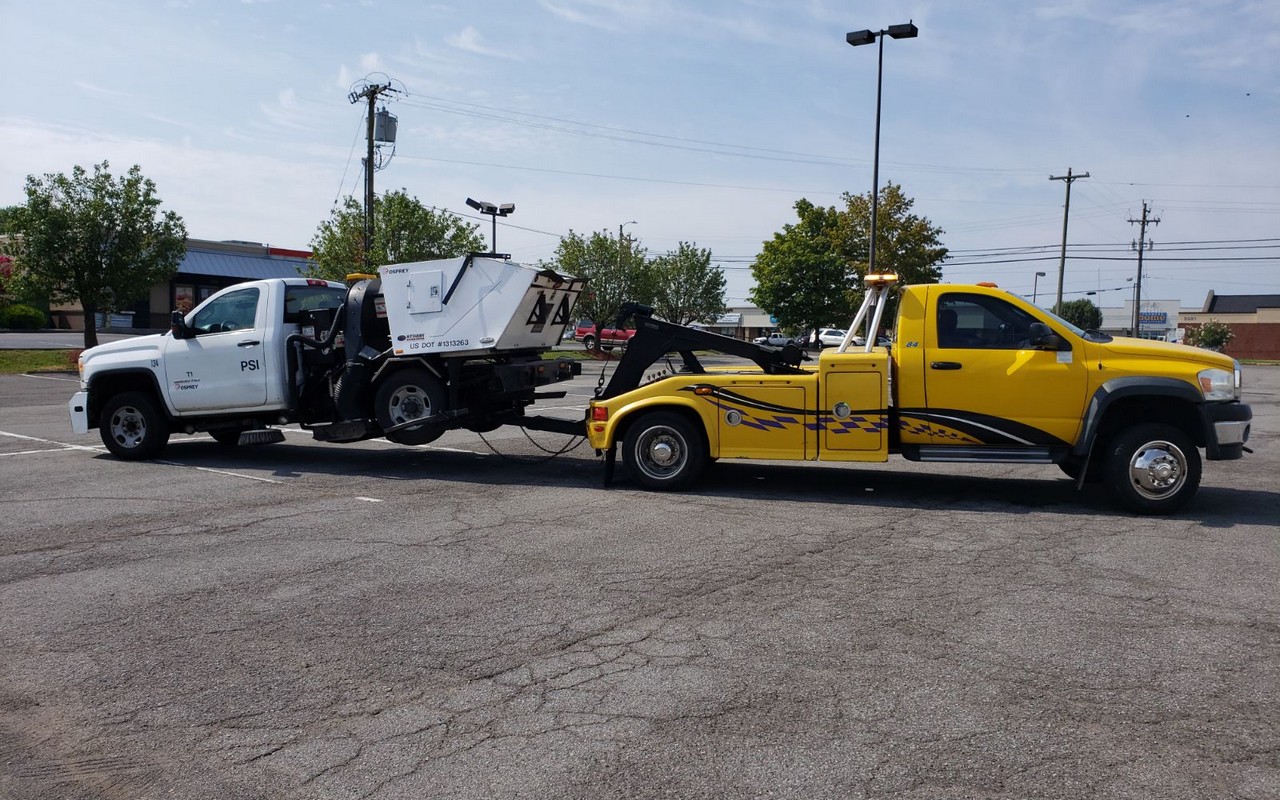 Yellow wheel-lift tow truck ready for winter emergency towing service in Nashville