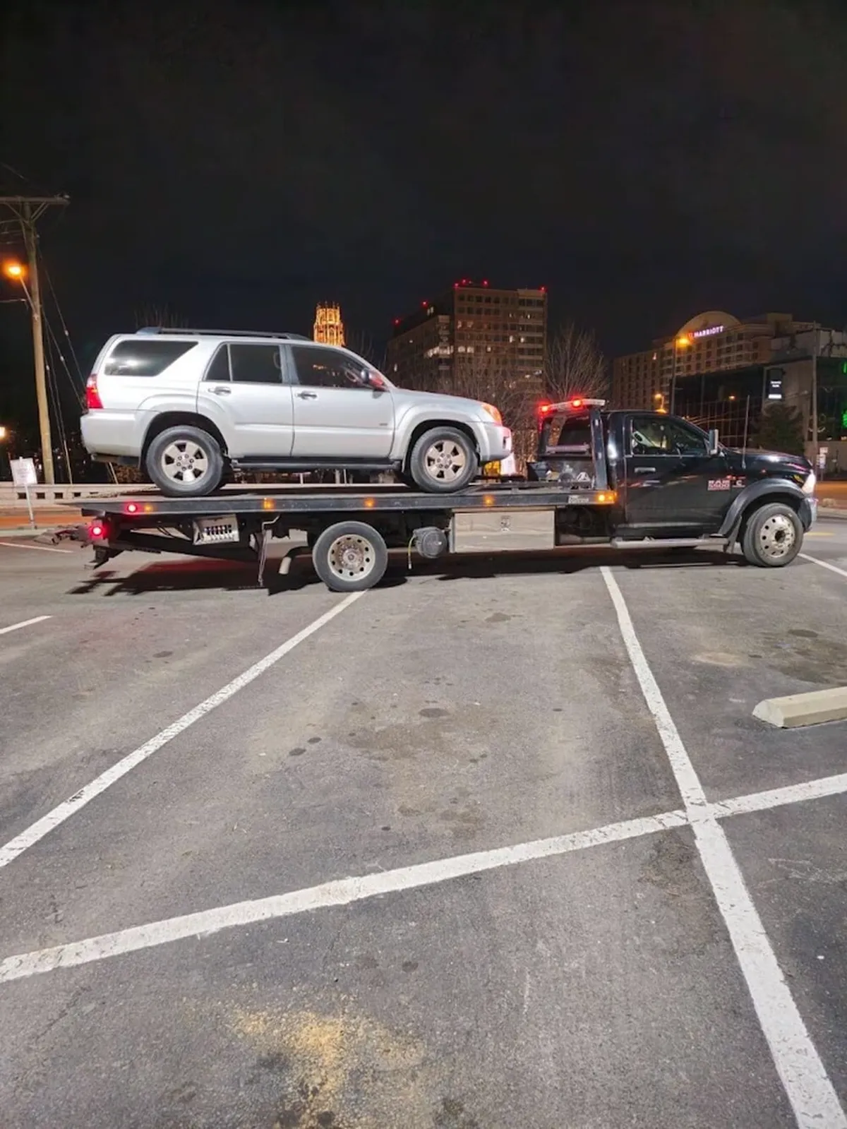 SUV towed on a downtown Nashville street