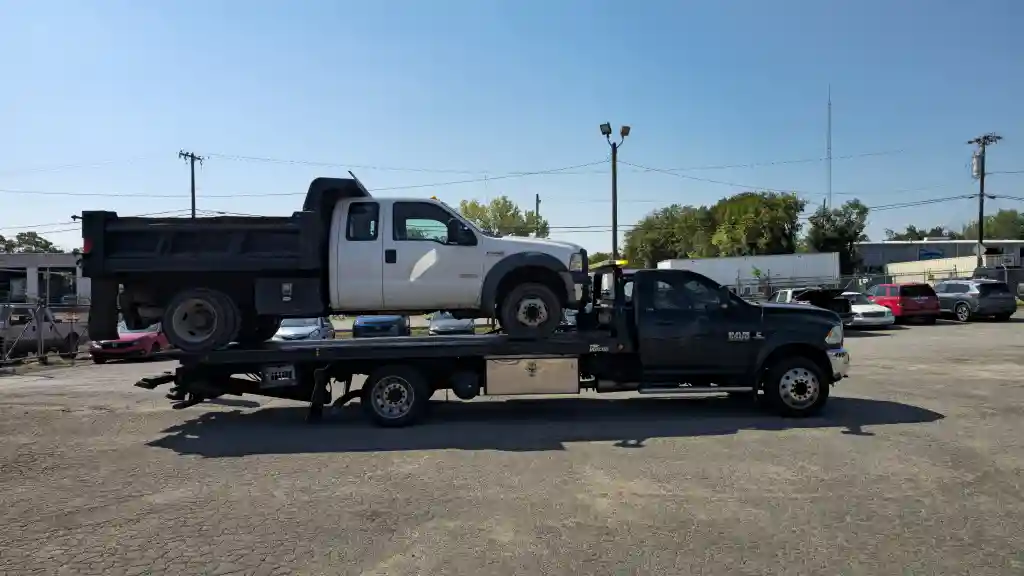 Dump truck hauled on a Hook Em' Up Towing flatbed in Nashville, TN
