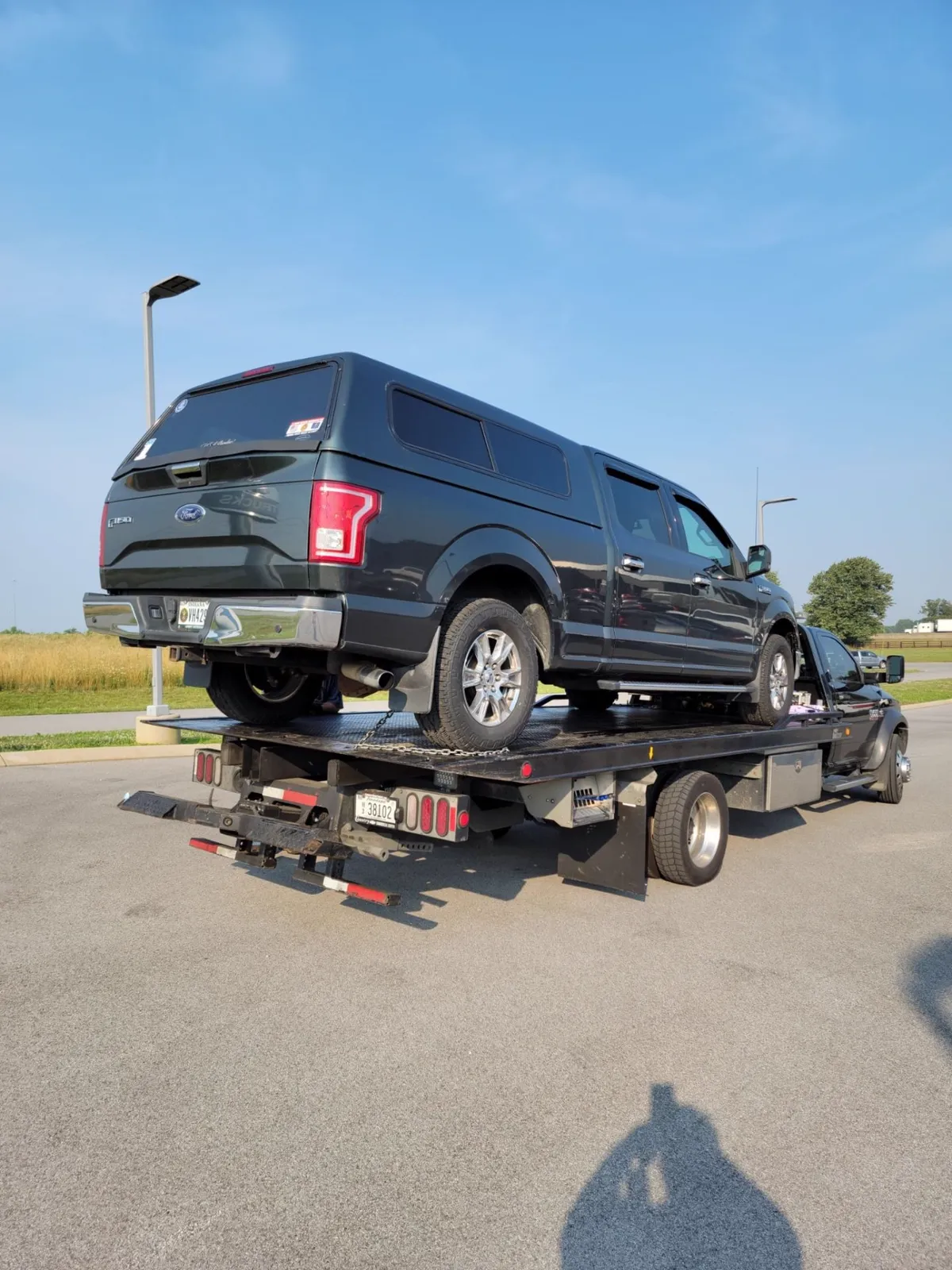 Ford F-150 pickup winched onto a flatbed tow truck in Nashville