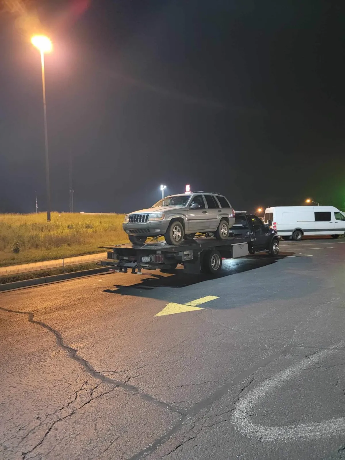 Jeep Cherokee towed at night in Nashville, TN